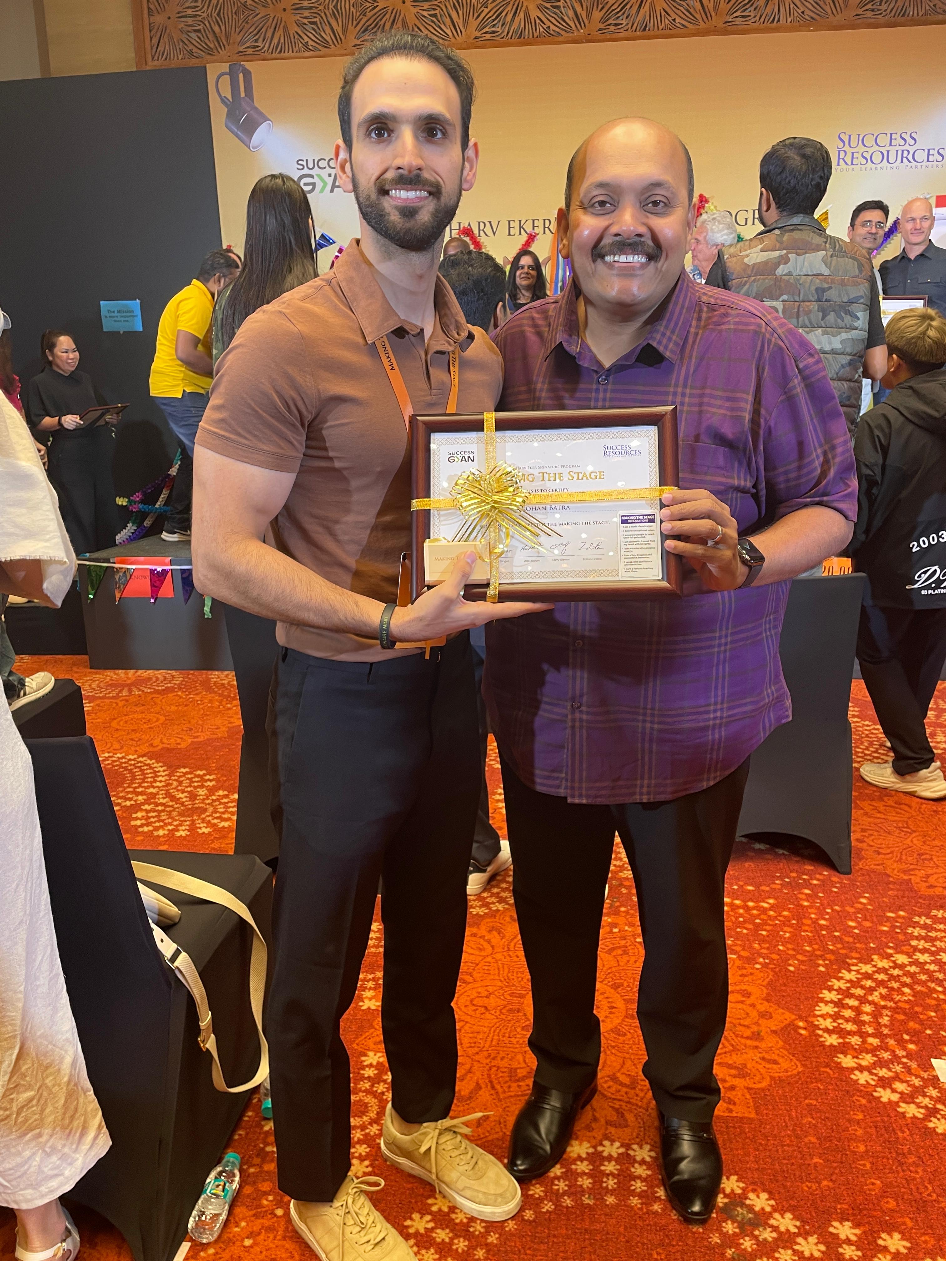 Rohan Batra receiving award